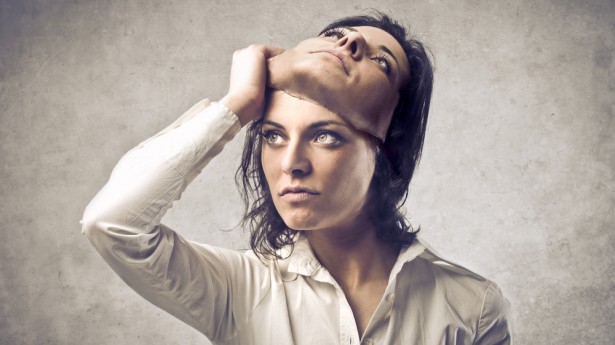 Woman-pulling-off-a-mask