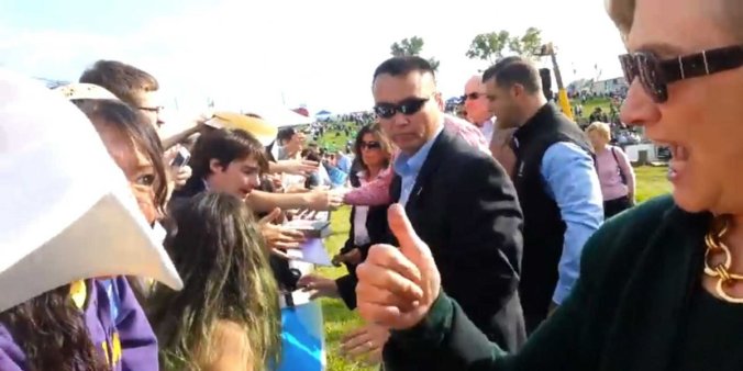 Psst! The "thumbs up" really means, "I like your shoes"...