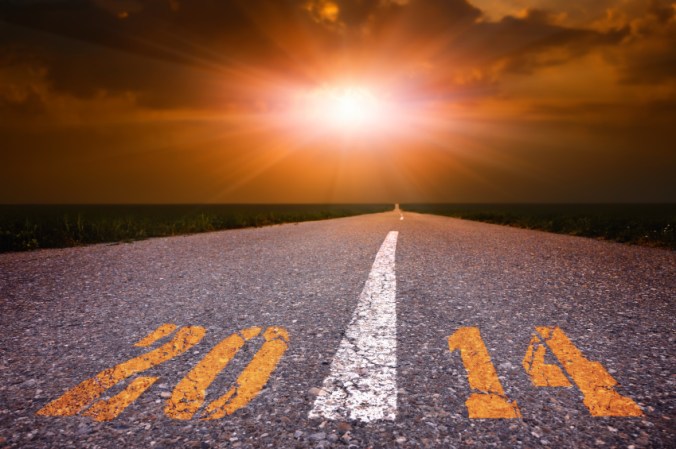 Driving on an empty road towards the setting sun 2014