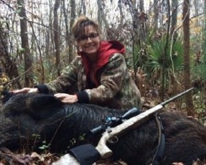 NewsLo Caption: "Palin Posed with dead hog: 'I picked a black one so no one could say I was racist!'" Yes, your Democratic neighbor believes this crap, and is posting it on Facebook right now...